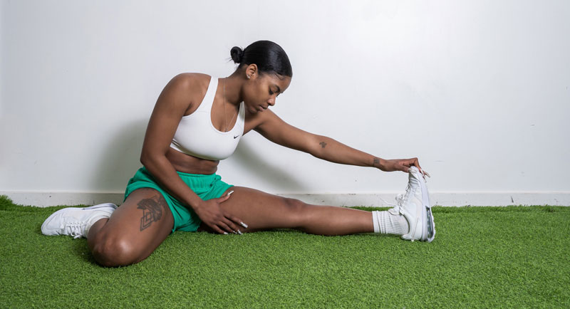 The coach is stretching