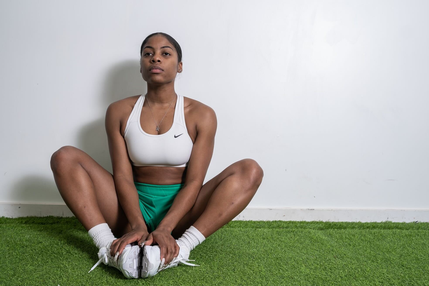 The coach is sitting.